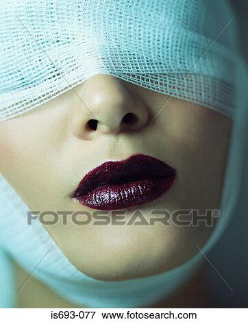 Woman wearing bandage and lipstick View Large Photo Image Stock Photo - Woman wearing bandage and lipstick. Fotosearch