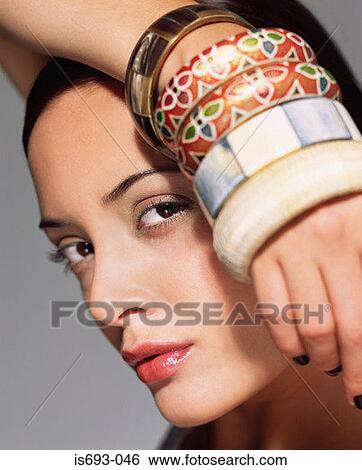 Woman wearing different bracelets View Large Photo Image Stock Photograph - Woman wearing different bracelets. Fotosearch
