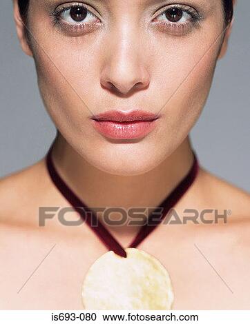 Woman wearing golden pendant View Large Photo Image Stock Image - Woman wearing golden pendant. Fotosearch