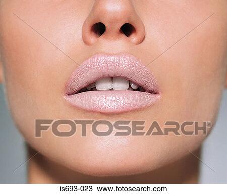 Woman wearing pale lipstick View Large Photo Image Stock Image - Woman wearing pale lipstick. Fotosearch