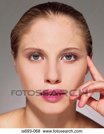 Woman wearing pink lipstick View Large Photo Image Stock Photo - Woman wearing pink lipstick. Fotosearch