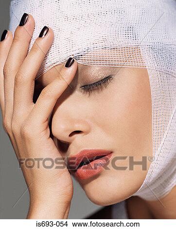 Woman with bandage around her head View Large Photo Image Picture - Woman with bandage around her head. Fotosearch