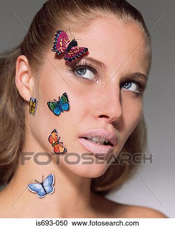 Woman with butterflies on her face View Large Photo Image Stock Image - Woman with butterflies on her face. Fotosearch