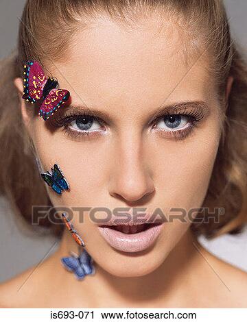 Woman with butterflies on her face View Large Photo Image Stock Image - Woman with butterflies on her face. Fotosearch