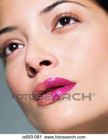 Woman with half of her mouth painted View Large Photo Image Stock Image - Woman with half of her mouth painted. Fotosearch