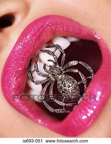 Woman with jewel spider in her mouth View Large Photo Image Stock Image - Woman with jewel spider in her mouth. Fotosearch