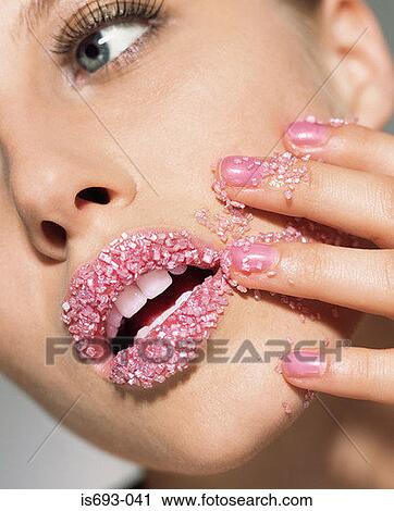 Woman with pink sugar crystals on her lips View Large Photo Image Stock Image - Woman with pink sugar crystals on her lips. Fotosearch