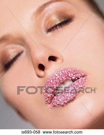 Woman with pink sugar crystals on her lips View Large Photo Image Stock Photo - Woman with pink sugar crystals on her lips. Fotosearch