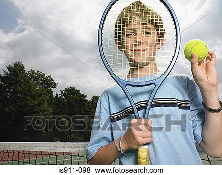 Boy holding tennis racket and ball View Large Photo Image Stock Photo - Boy holding tennis racket and ball. Fotosearch