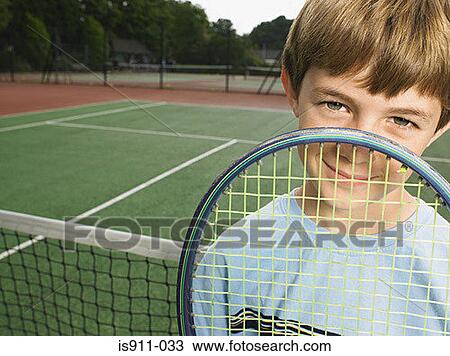 Stock Image - Boy with tennis racket. Fotosearch