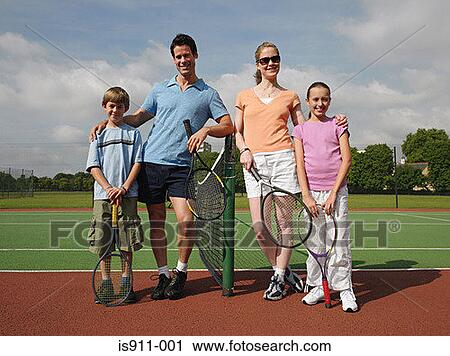 Family on a tennis court View Large Photo Image Stock Image - Family on a tennis court. Fotosearch
