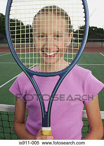 Stock Photography - Girl holding up a tennis racket. Fotosearch