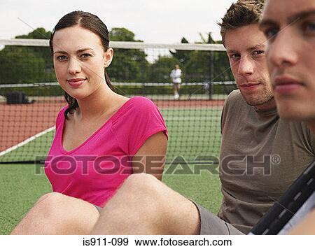 Young people on a tennis court View Large Photo Image Stock Photo - Young people on a tennis court. Fotosearch