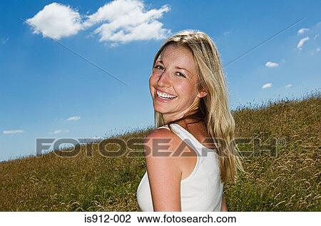 Woman in a field View Large Photo Image Stock Image - Woman in a field. Fotosearch