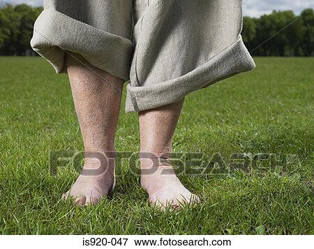 Stock Photo - Bare foot woman in the park. Fotosearch