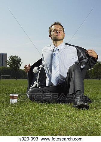 Businessman in the park View Large Photo Image Stock Image - Businessman in the park. Fotosearch