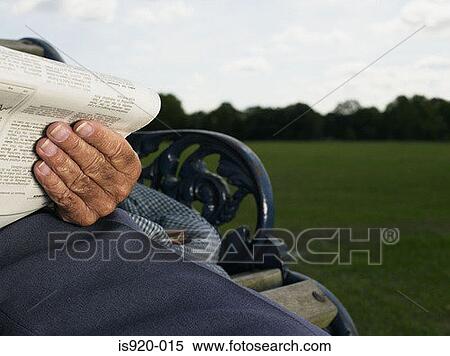 Elderly man reading in a park View Large Photo Image Stock Photography - Elderly man reading in a park. Fotosearch