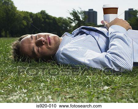 Man sleeping in the park View Large Photo Image Stock Image - Man sleeping in the park. Fotosearch