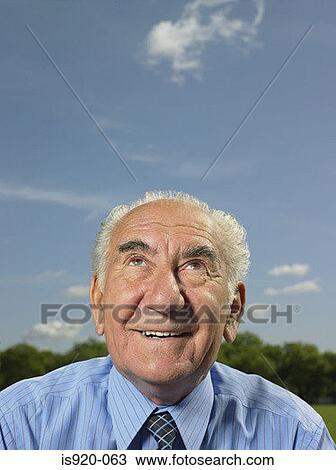 Thoughtful looking elderly man View Large Photo Image Stock Image - Thoughtful looking elderly man. Fotosearch