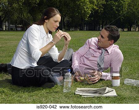 Two colleagues having lunch View Large Photo Image Stock Image - Two colleagues having lunch. Fotosearch