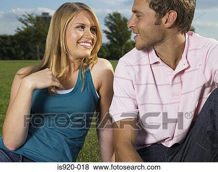 Young couple flirting View Large Photo Image Stock Photo - Young couple flirting. Fotosearch