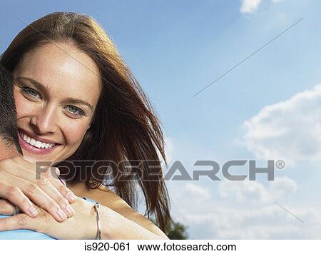 Stock Image - Young couple hugging. Fotosearch