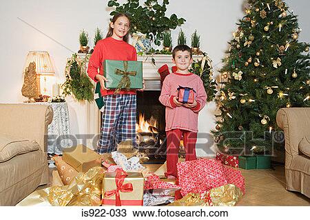 Children holding christmas gifts View Large Photo Image Stock Image - Children holding christmas gifts. Fotosearch