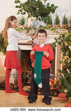 Children with christmas stockings View Large Photo Image Picture - Children with christmas stockings. Fotosearch