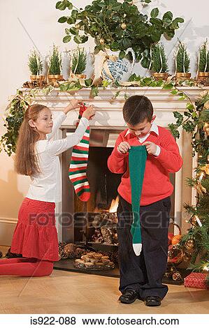 Children with christmas stockings View Large Photo Image Stock Photo - Children with christmas stockings. Fotosearch