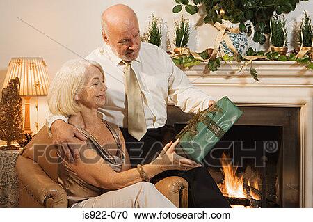 Elderly couple exchanging gifts View Large Photo Image Stock Image - Elderly couple exchanging gifts. Fotosearch