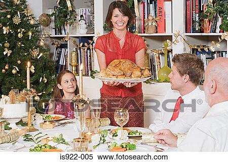 Family at dining table at christmas View Large Photo Image Stock Photography - Family at dining table at christmas. Fotosearch