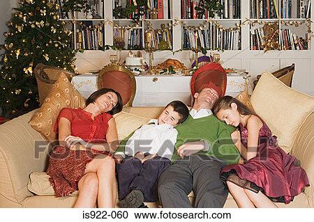 Family sleeping on sofa at christmas View Large Photo Image Stock Image - Family sleeping on sofa at christmas. Fotosearch
