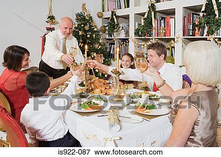 Stock Photo - Family toasting at christmas. Fotosearch