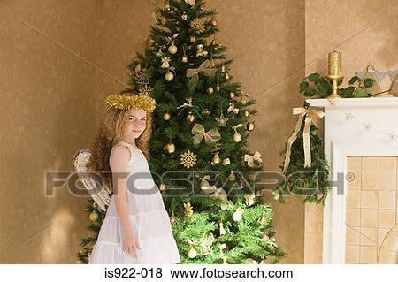 Girl dressed as an angel at christmas View Large Photo Image Stock Photo - Girl dressed as an angel at christmas. Fotosearch