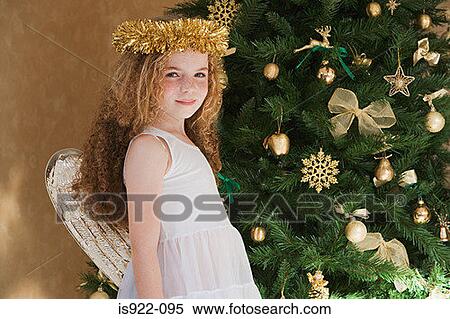 Stock Photography - Girl dressed as an angel at christmas. Fotosearch