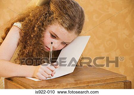 Girl writing a greetings card View Large Photo Image Stock Image - Girl writing a greetings card. Fotosearch
