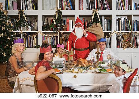 Stock Photo - Santa claus at christmas dinner. Fotosearch