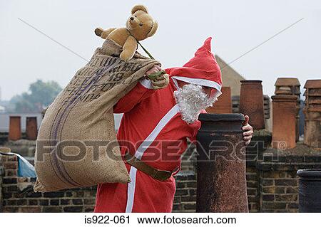 Santa claus delivering gifts View Large Photo Image Stock Image - Santa claus delivering gifts. Fotosearch