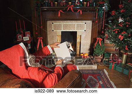 Santa claus reading a note View Large Photo Image Stock Photo - Santa claus reading a note. Fotosearch