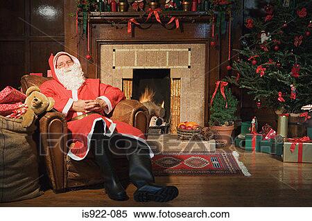 Santa claus resting in an armchair View Large Photo Image Stock Photography - Santa claus resting in an armchair. Fotosearch