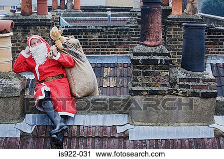 Santa claus sitting on a roof View Large Photo Image Stock Image - Santa claus sitting on a roof. Fotosearch