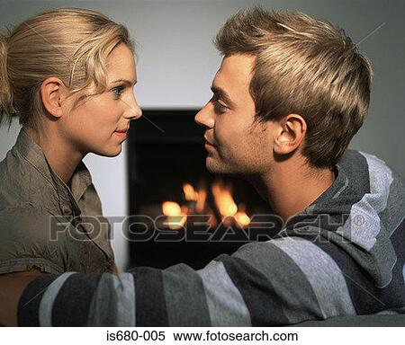 Couple by a fire View Large Photo Image Stock Photography - Couple by a fire. Fotosearch