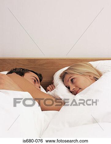 Couple in bed View Large Photo Image Stock Photograph - Couple in bed. Fotosearch