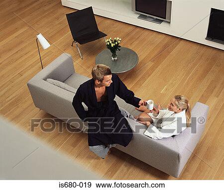 Couple in their bathrobes View Large Photo Image Stock Photo - Couple in their bathrobes. Fotosearch