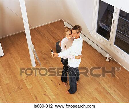 Couple in their new home View Large Photo Image Stock Image - Couple in their new home. Fotosearch