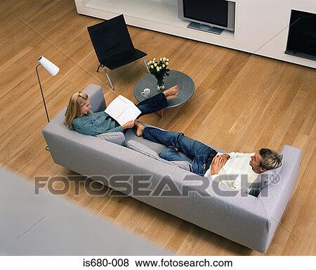 Stock Photo - Couple relaxing at home. Fotosearch
