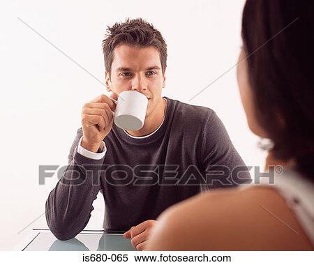 Stock Photography - Man having coffee with woman. Fotosearch