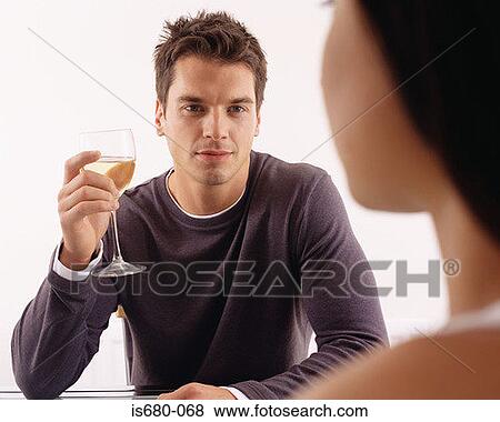 Man having wine with woman View Large Photo Image Stock Photo - Man having wine with woman. Fotosearch