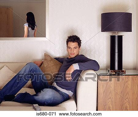 Man on the sofa View Large Photo Image Stock Image - Man on the sofa. Fotosearch