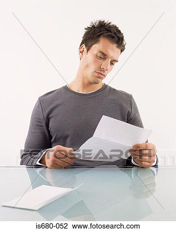 Man reading a letter View Large Photo Image Stock Image - Man reading a letter. Fotosearch